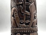 an image of a wooden sculpture of a woman and a man