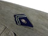 a small patch on the lapel of a man ' s jacket