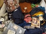 a suitcase full of clothes and other items in it