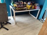 a table with a lot of liquor bottles on top of it