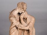 statue of a woman holding a child in her arms