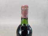 a bottle of wine that is sitting on a table