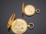 an image of two gold pocket watches on a black surface