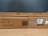two boxes of brown paper sitting on top of a wooden table