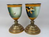 two vases that are sitting on top of each other