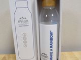 packaging of a water bottle and a box on a wooden table
