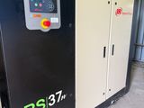 a close up of an air compressor in a warehouse