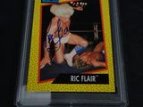 an autograph of a wrestling card signed by ric flair