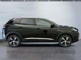 the black suv is parked in the garage of a building