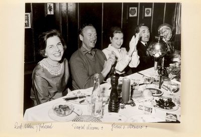 black and white photograph of a family sitting at a dinner table