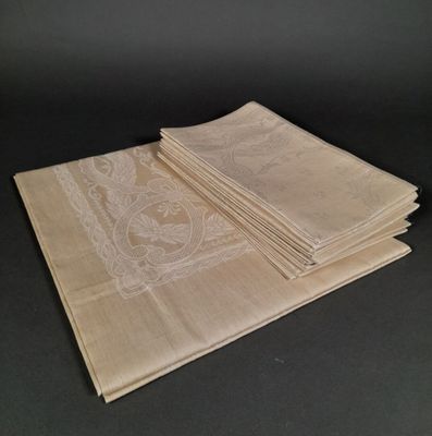 four folded napkins on a table with a black background