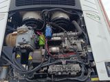 a truck with a large engine in the back of it