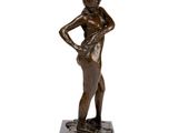 the statue of a woman is standing with her hands on her hips