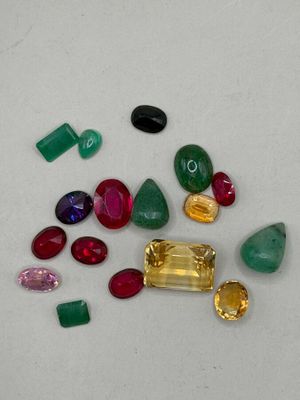 assorted gems on a white surface with a white background