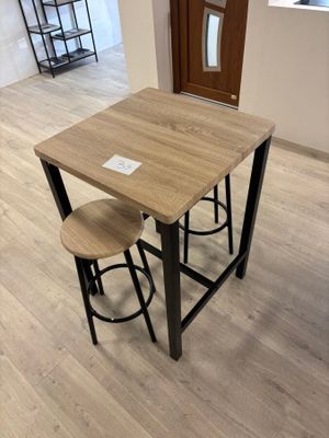 a table with two stools on it in a room