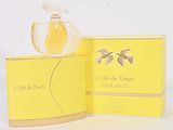an image of a bottle of perfume sitting on top of a yellow box