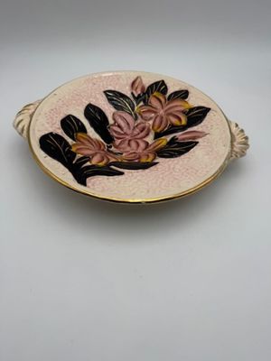 a close up of a plate with flowers on it