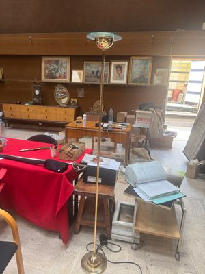 a room that has a table with a red table cloth on it