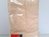 a close up of a bag of rice sitting on a table