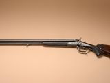 a rifle on a wall with a brown background