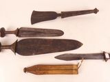 four different types of knifes are displayed on a white surface