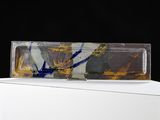 a glass object on top of a box on a table