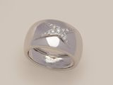 an image of a silver ring with diamonds on a white background