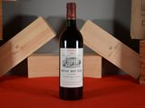 a bottle of wine that is sitting on a table