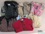 a lot of clothes that are sitting on a table