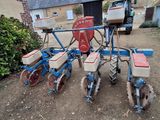an image of a tractor with a seeder attached to it