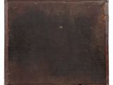 an old wooden box with a label on it sitting on top of a white surface