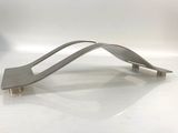 a metal object that is sitting on a white surface