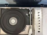 a record player sitting inside of a metal case