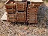 several pieces of wood are stacked on top of each other on the ground
