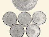 a lot of glass plates that are sitting on a table