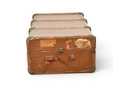three old suitcases stacked on top of each other