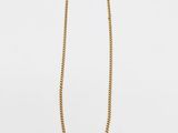 a gold chain necklace with a gold clasp on a white background