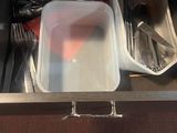 an image of a drawer full of food and utensils