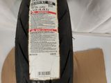 an image of a motorcycle tire on top of a cardboard box