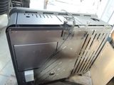 an image of a broken toaster oven sitting on the floor