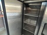 a refrigerator with a door open in a room