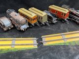 several toy trains are lined up on a black surface