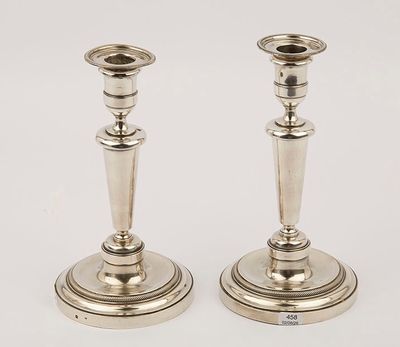 a pair of silver candlesticks from the early 20th century