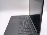 a laptop with a black keyboard sitting on a table
