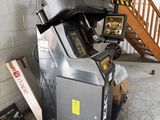 a machine that is sitting next to a stair case