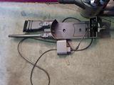 a cord connected to a device that is plugged into the ground