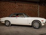 an image of a white car parked in a garage