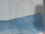 a plastic bag that has a pair of scissors on it