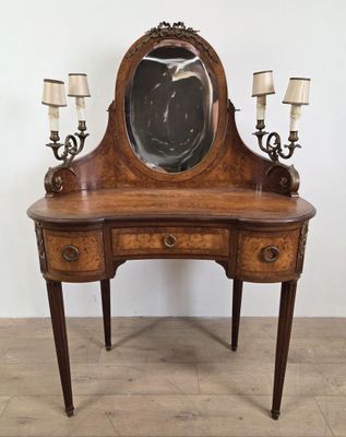 an image of a wooden vanity with a mirror on top of it
