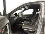 the interior of a car with the door open showing the driver ' s seat area